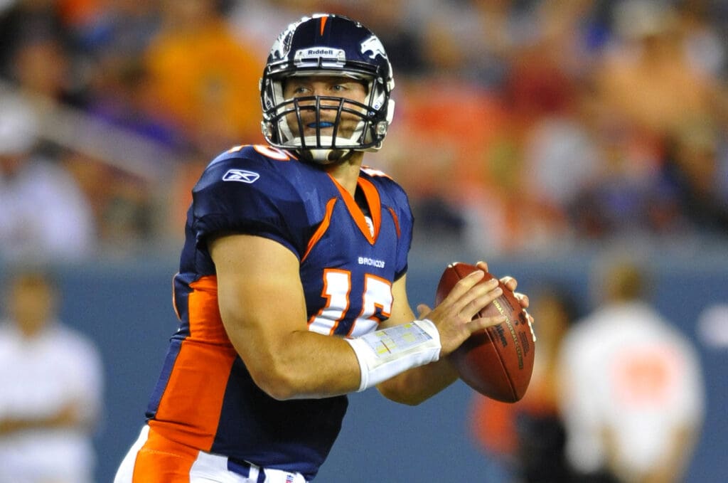 Aug 29, 2010; Denver, CO, USA; Denver Broncos quarterback Tim Tebow (15) prepares to throw in the second half against the Pittsburgh Steelers at Invesco Field. The Broncos defeated the Steelers 34-17. Mandatory Credit: Ron Chenoy-USA TODAY Sports