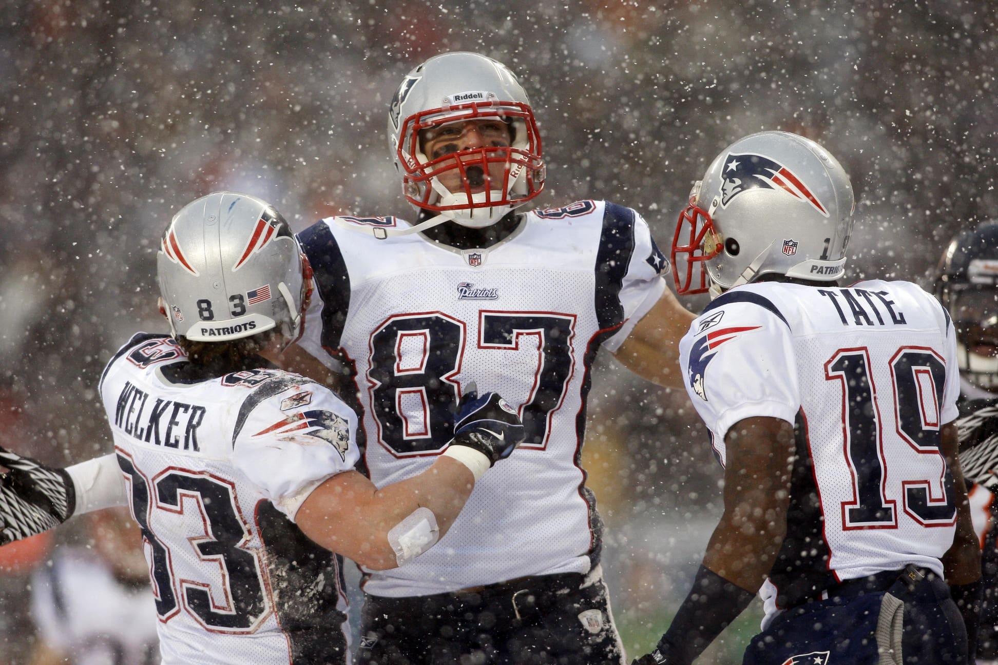 Dec 12, 2010; Chicago, IL, USA; New England Patriots tight end Rob Gronkowski (87) celebrates with teammates Wes Welker (83) and Brandon Tate (19) after scoring a touchdown during the first quarter against the Chicago Bears at Soldier Field. Mandatory Credit: Jerry Lai-USA TODAY Sports
