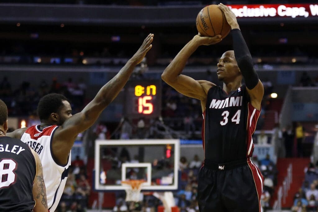 Apr 14, 2014; Washington, DC, USA; Miami Heat guard Ray Allen (34) shoots the ball over Washington Wizards forward Martell Webster (9) in the third quarter at Verizon Center. The Wizards won 114-93. Mandatory Credit: Geoff Burke-USA TODAY Sports