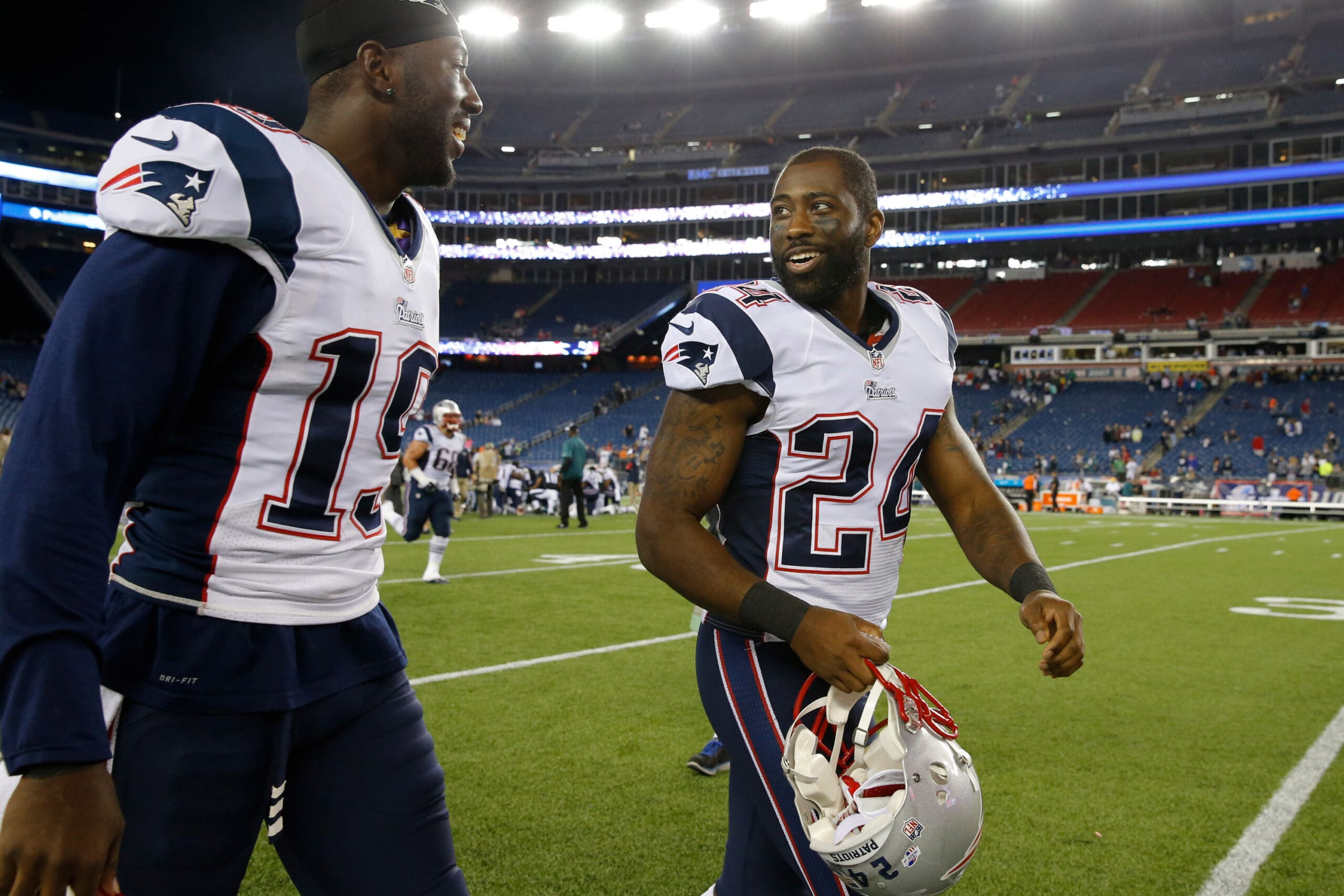 Aug 15, 2014; Foxborough, MA, USA; New England Patriots cornerback Darrelle Revis (24) heads off the field with wide receiver Brandon LaFell (19) after the preseason game at Gillette Stadium. The New England Patriots defeated the Philadelphia Eagles 42-35. Mandatory Credit: David Butler II-USA TODAY Sports