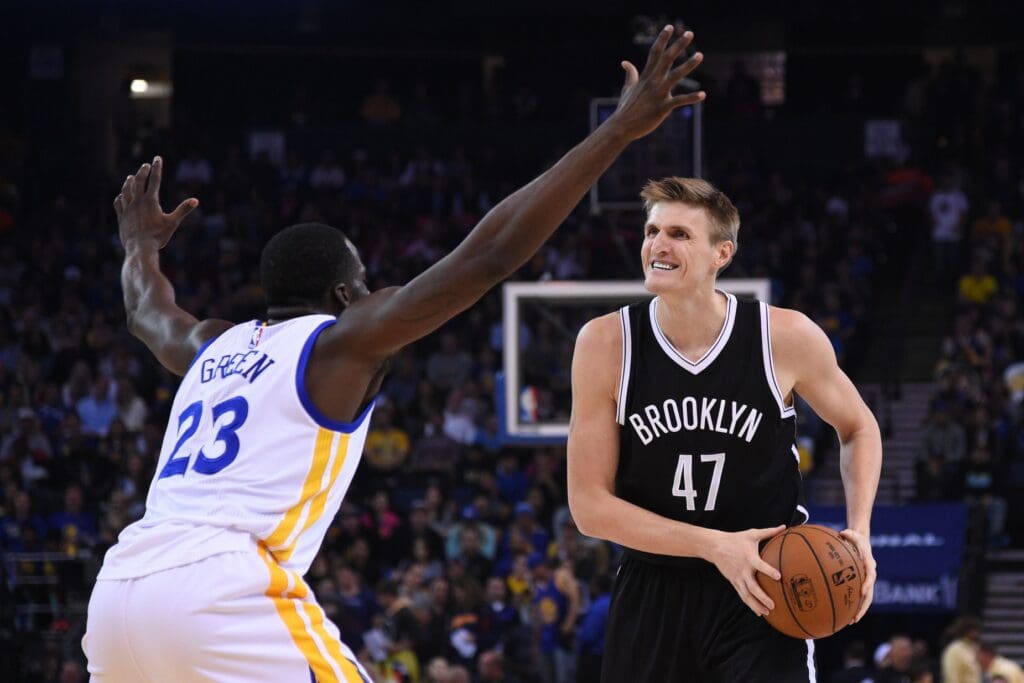 November 13, 2014; Oakland, CA, USA; Brooklyn Nets forward Andrei Kirilenko (47) controls the basketball against Golden State Warriors forward Draymond Green (23) during the first quarter at Oracle Arena. Mandatory Credit: Kyle Terada-USA TODAY Sports