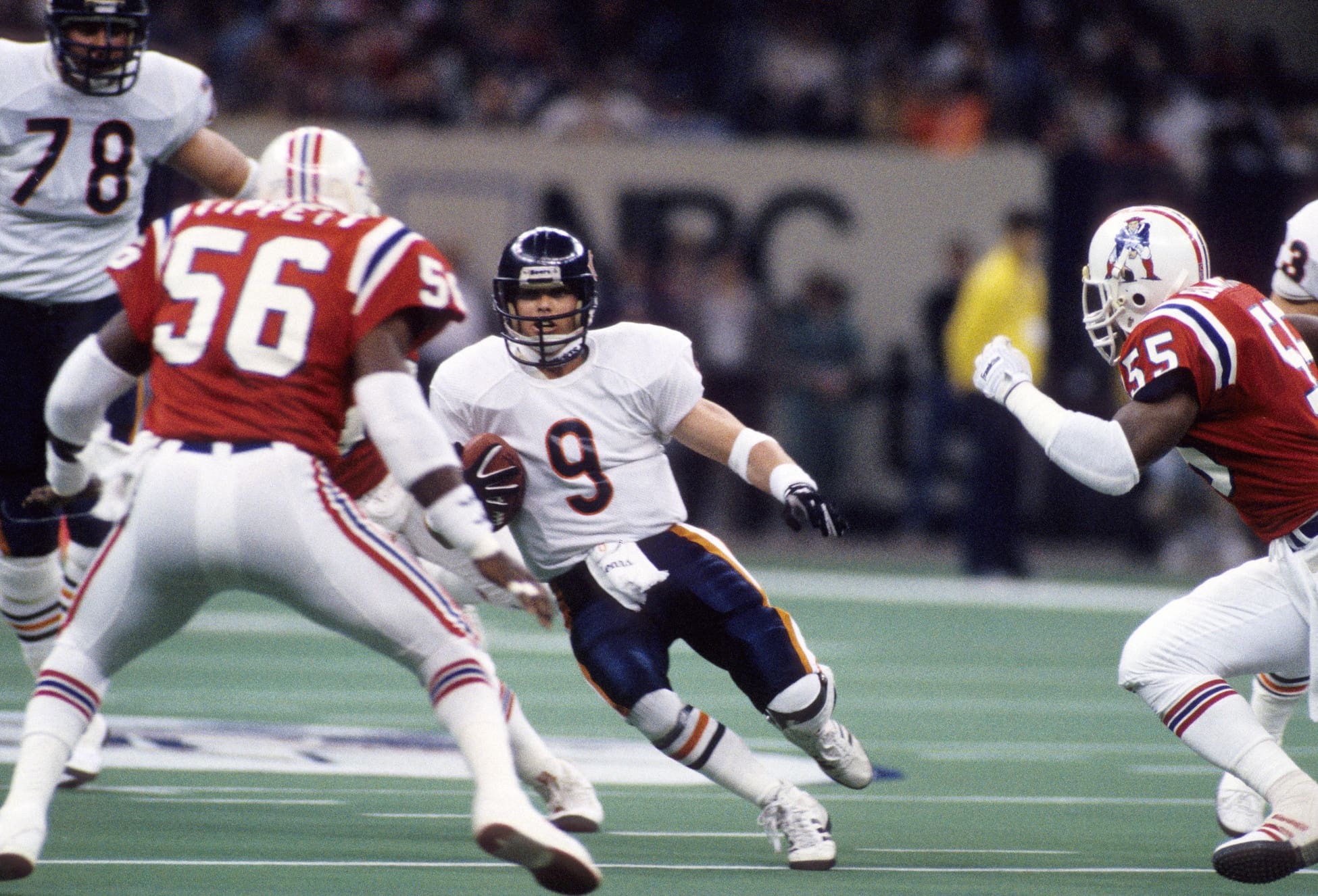 Jan 26, 1986; New Orleans, LA, USA; FILE PHOTO; Chicago Bears quarterback Jim McMahon (9) runs with the ball against New England Patriots linebacker Andre Tippett (56) during Super Bowl XX at the Superdome. The Bears defeated the Patriots 46-10. Mandatory Credit: Manny Rubio-USA TODAY Sports