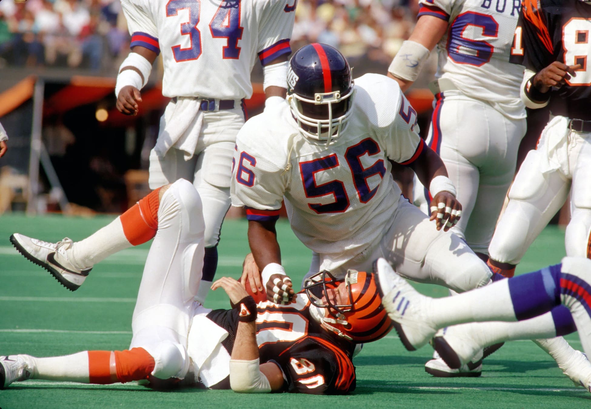 Oct 13, 1985; Cincinnati, OH, USA; FILE PHOTO; New York Giants Linebacker (56) LAWRENCE TAYLOR tackles Cincinnati Bengals Receiver (80) CRIS COLLINSWORTH at Riverfront Stadium. The Bengals defeated the Giants 35-30. Mandatory Credit: Tony Tomsic-USA TODAY NETWORK
