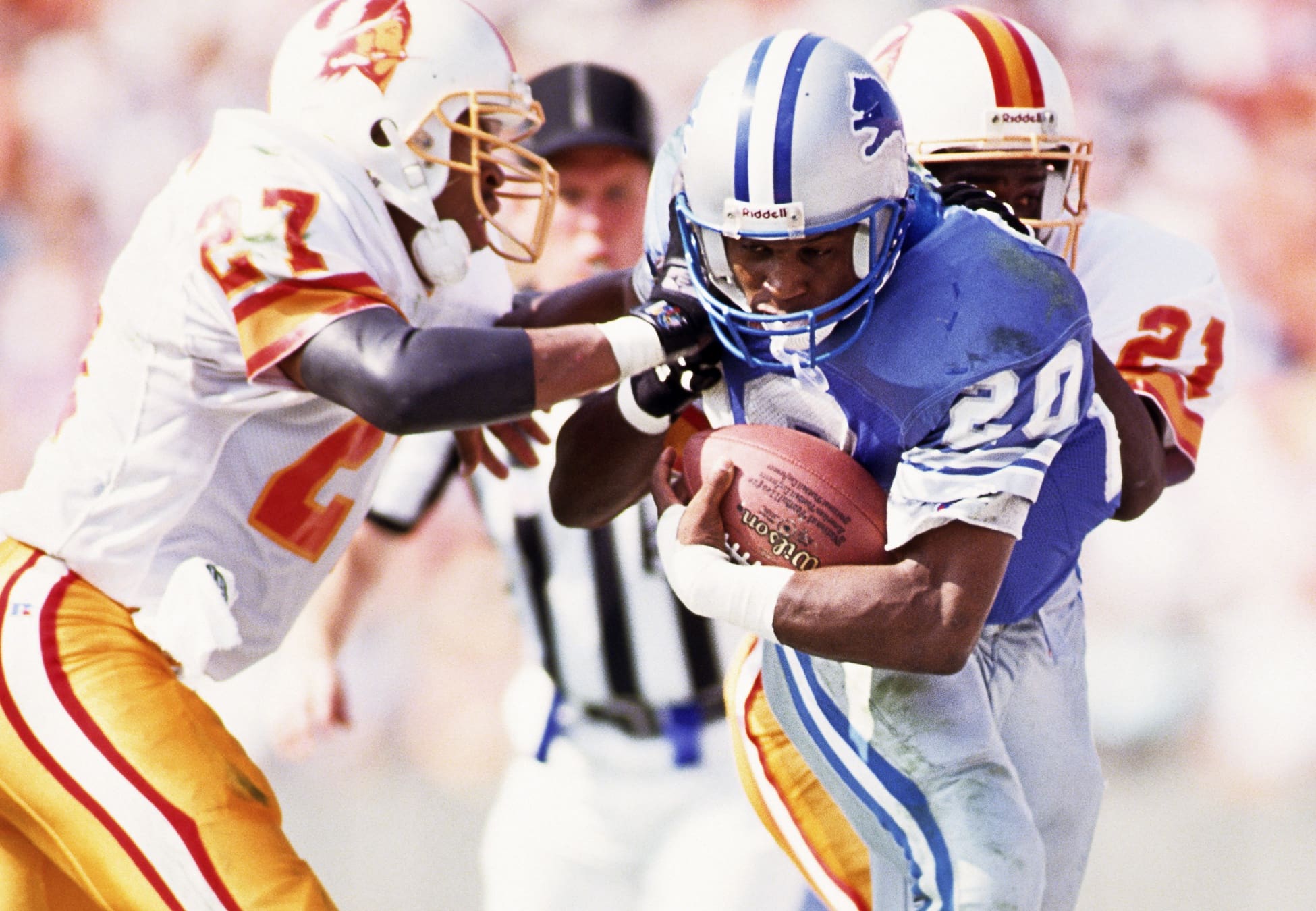 Oct 25, 1992; Tampa, FL, USA; FILE PHOTO; Detroit Lions running back Barry Sanders (20) in action against Tampa Bay Buccaneers defensive backs Darrell Fullington (27) and Milton Mack (21) at Tampa Stadium. Mandatory Credit: Lou Capozzola-USA TODAY NETWORK