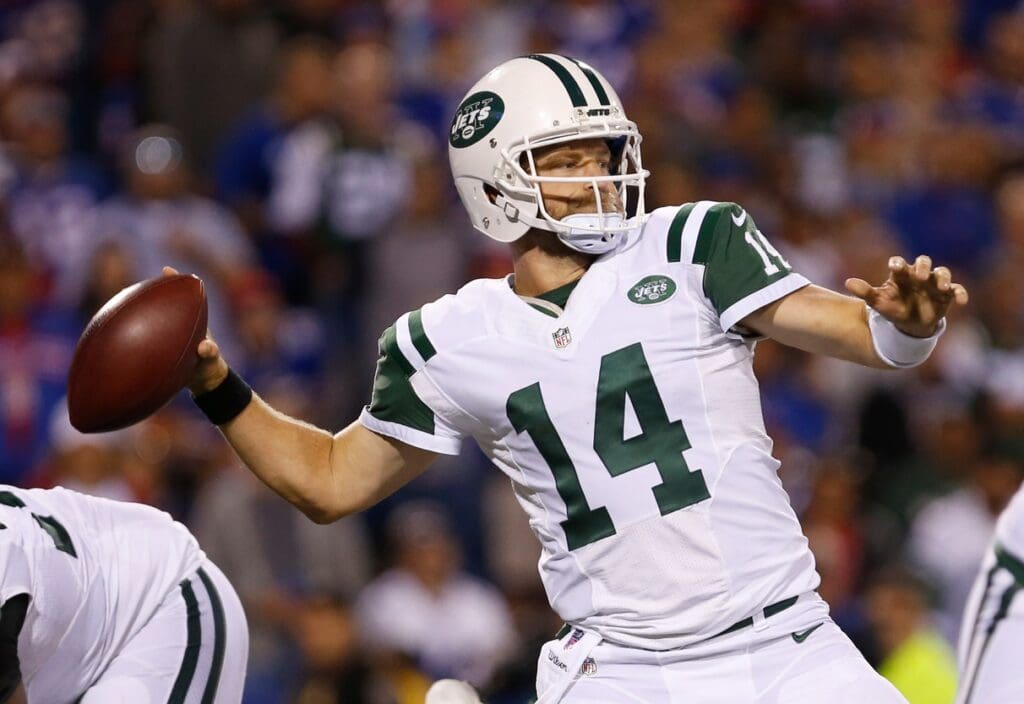 Sep 15, 2016; Orchard Park, NY, USA; New York Jets quarterback Ryan Fitzpatrick (14) throws a pass against the Buffalo Bills at New Era Field. The Jets beat the Bills 37 to 31. Mandatory Credit: Timothy T. Ludwig-USA TODAY Sports