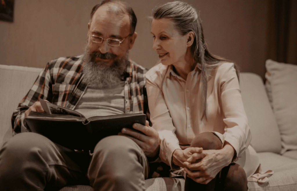 A couple reviewing goals or reminiscing with photo albums