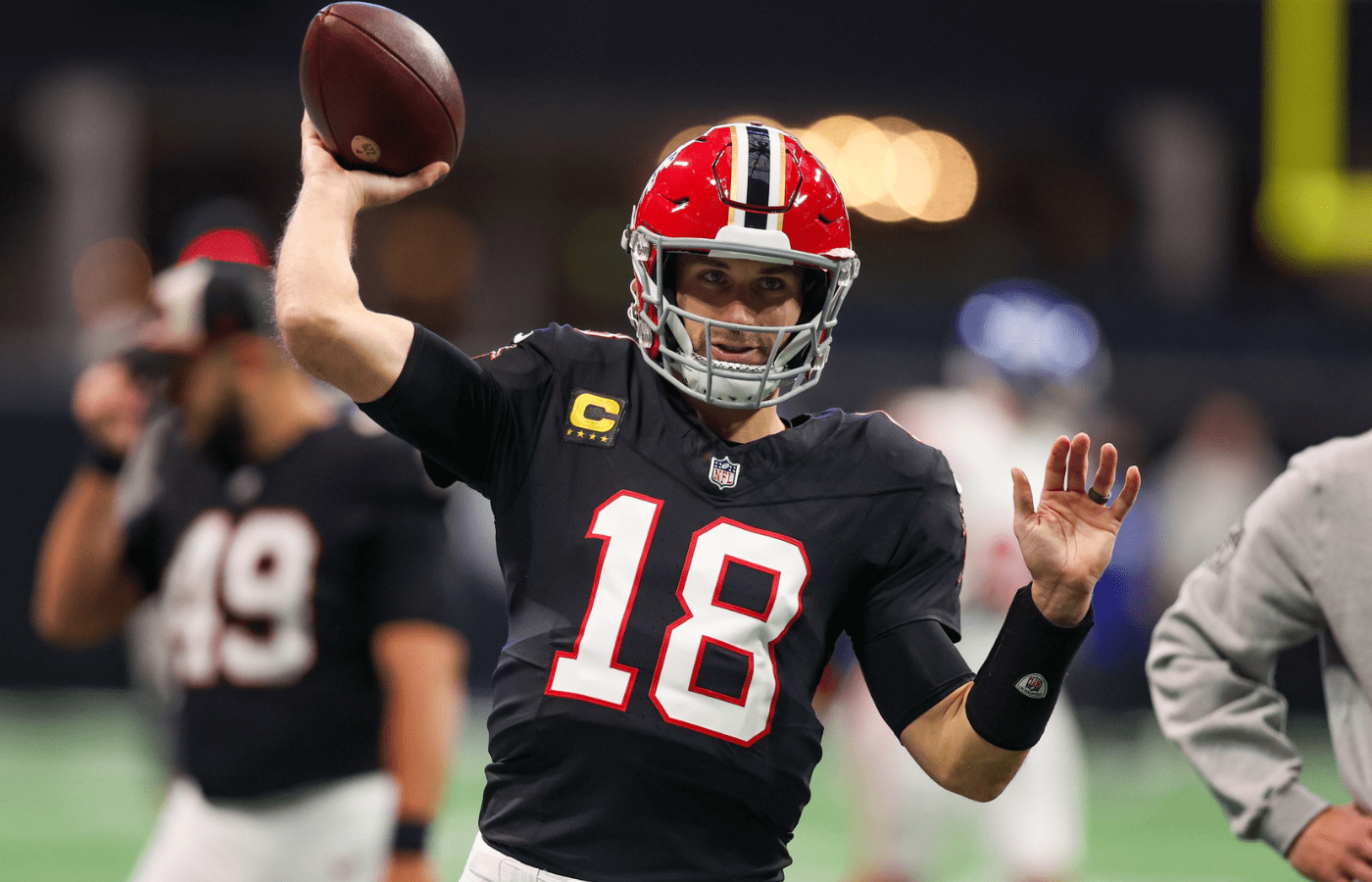 Atlanta Falcons quarterback Kirk Cousins (18) prepares for a game against the New York Giants at Mercedes-Benz Stadium