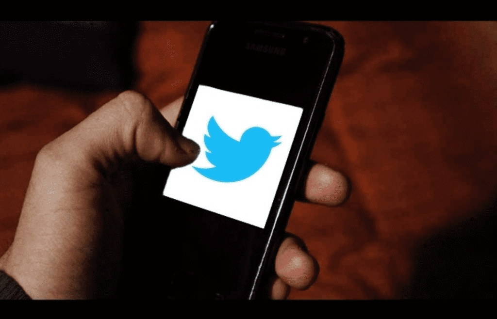 Twitter logo displayed on a mobile phone screen
