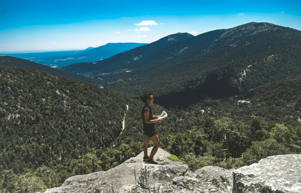 A person looking at a trail map