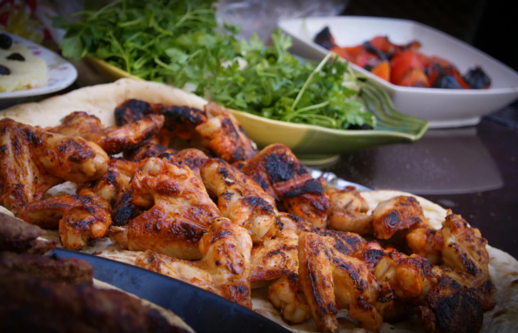 A platter of sticky, saucy grilled chicken drumsticks