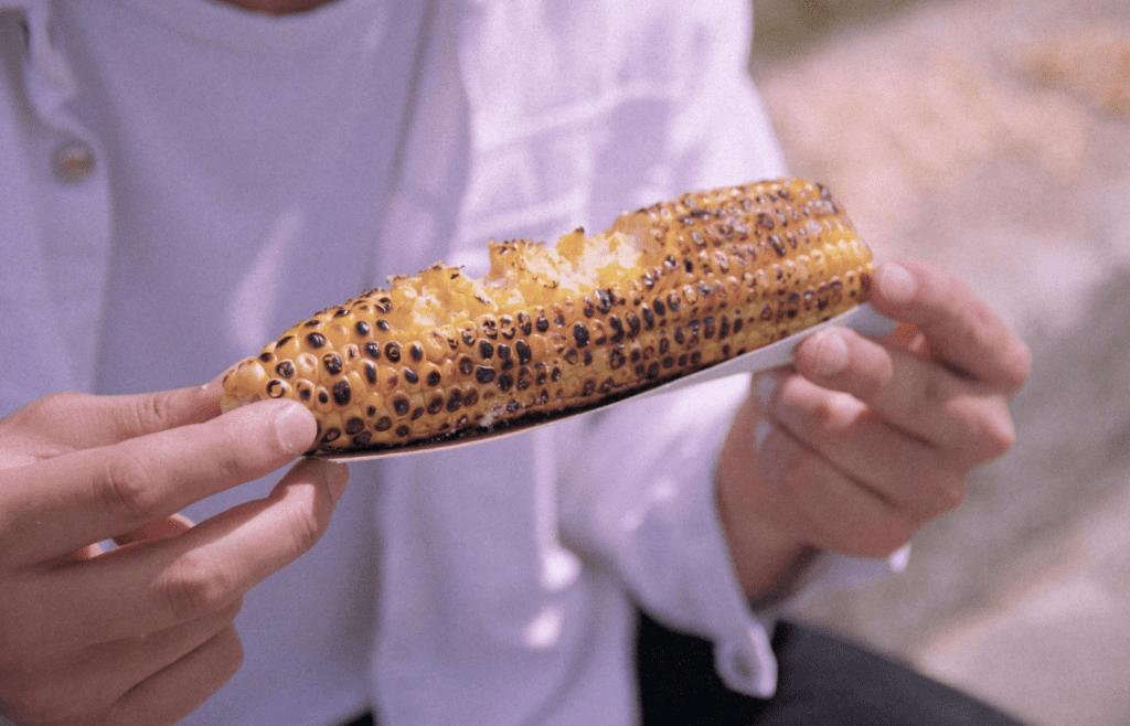 Corn on the cob with char marks and butter dripping down