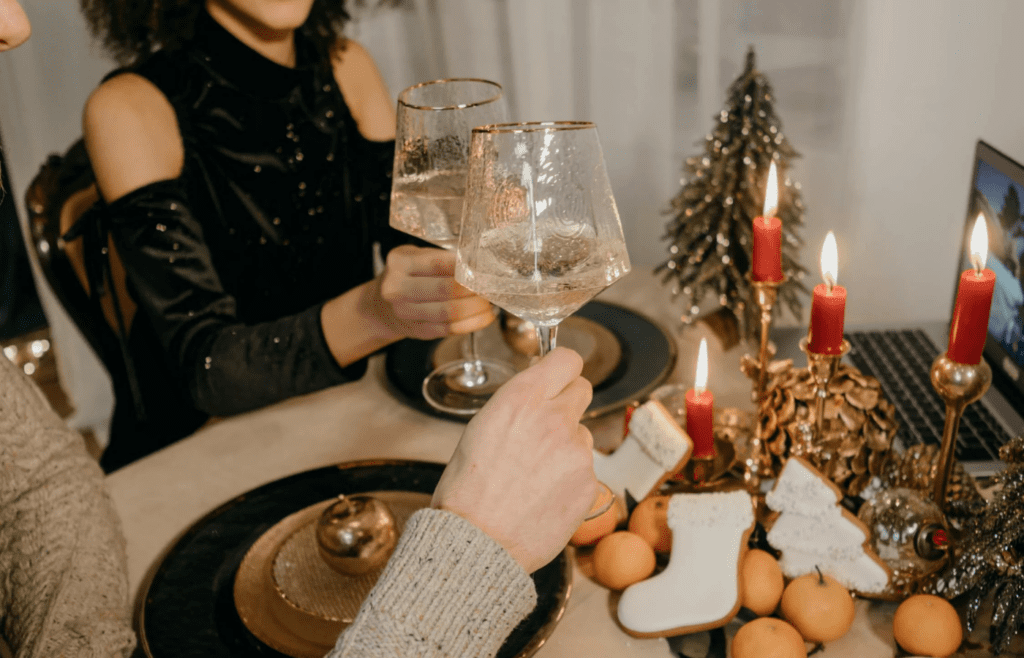 A couple lighting candles for dinner at home