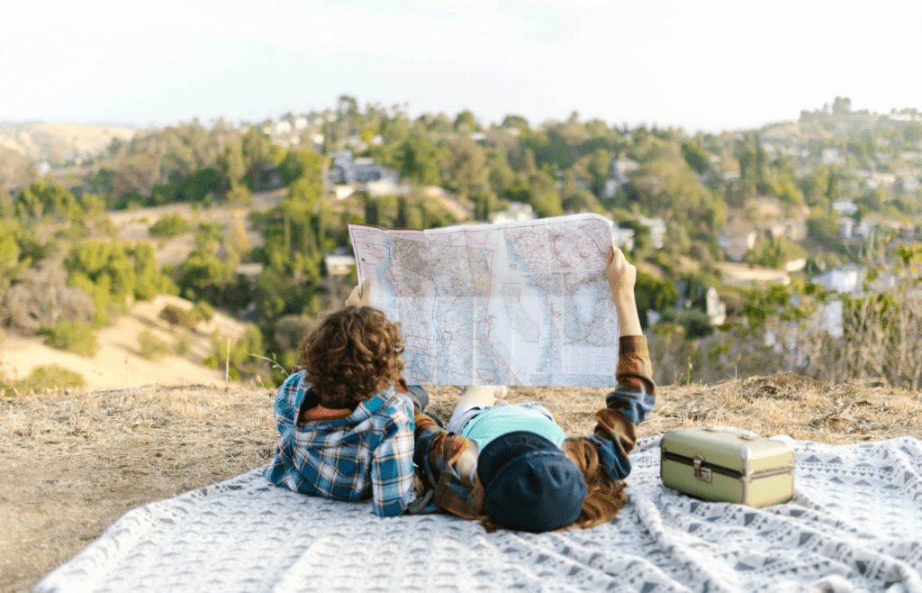 A couple looking at travel brochures or a map