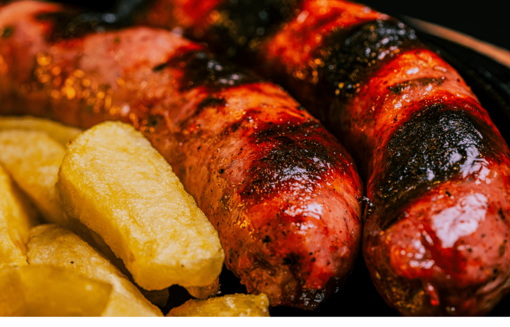 Hoagie rolls stuffed with grilled sausage and peppers