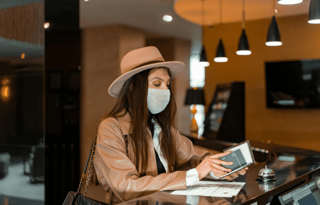 A relaxed traveler checking into a hotel early
