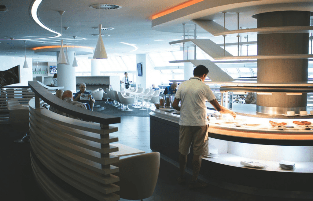 A comfortable airport lounge with buffet and seating areas