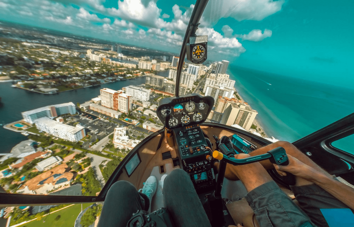 A helicopter flying over a dramatic coastline or city skyline