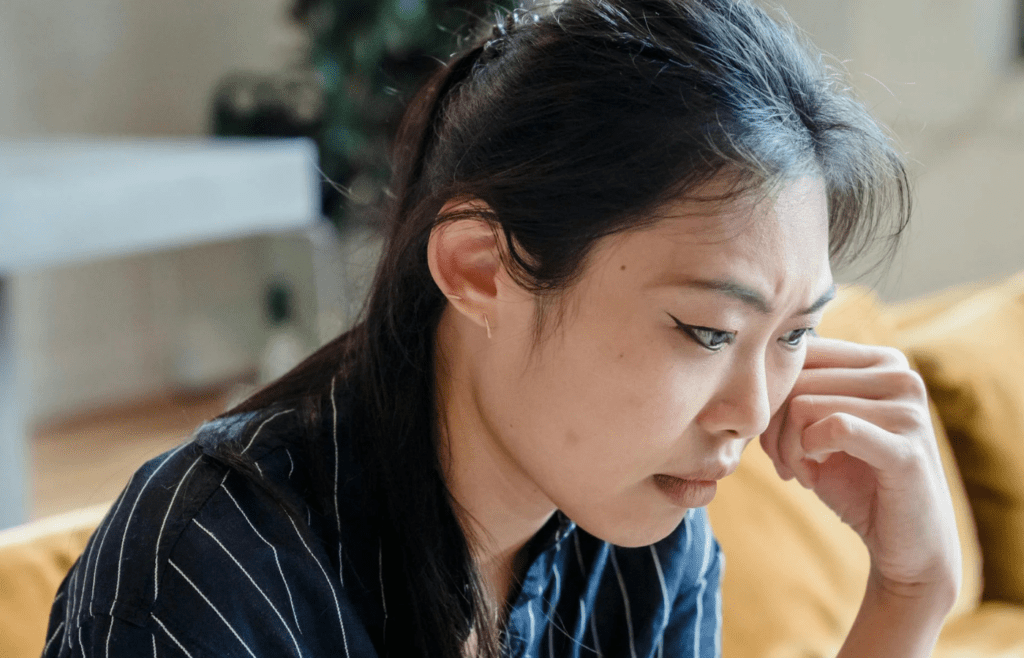 A person pushing through a tough moment with quiet resolve