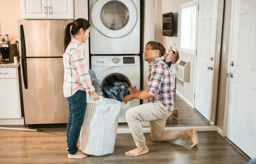 A couple trading off chores with lighthearted energy