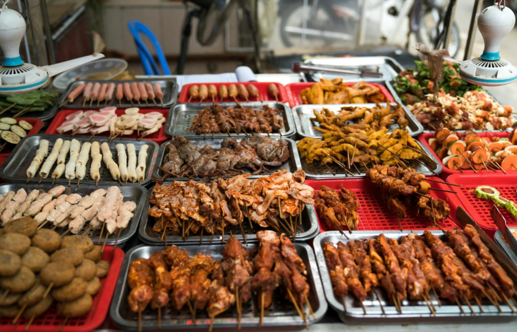 A tray of colorful pre-made kebabs ready for grilling