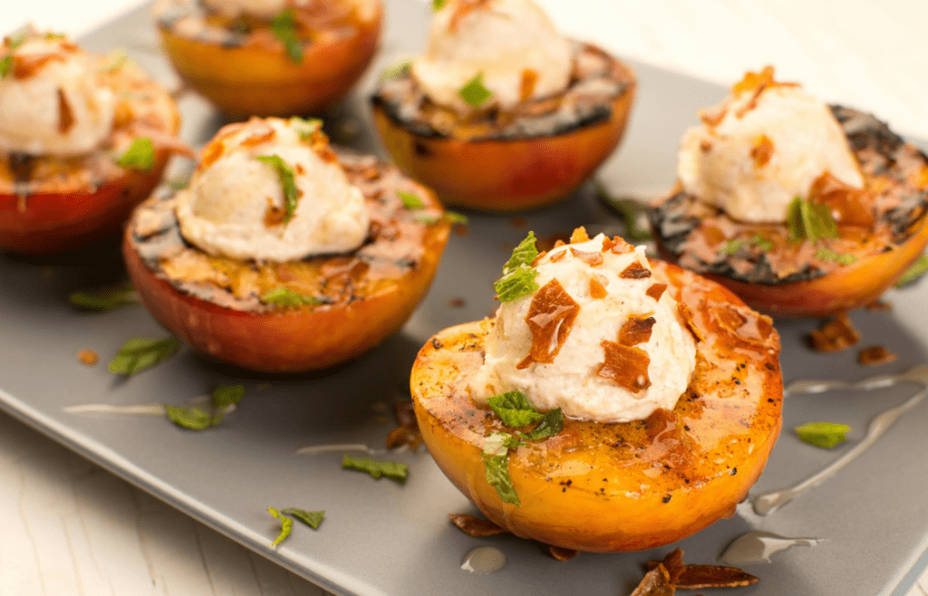 Grilled peaches with a scoop of ice cream