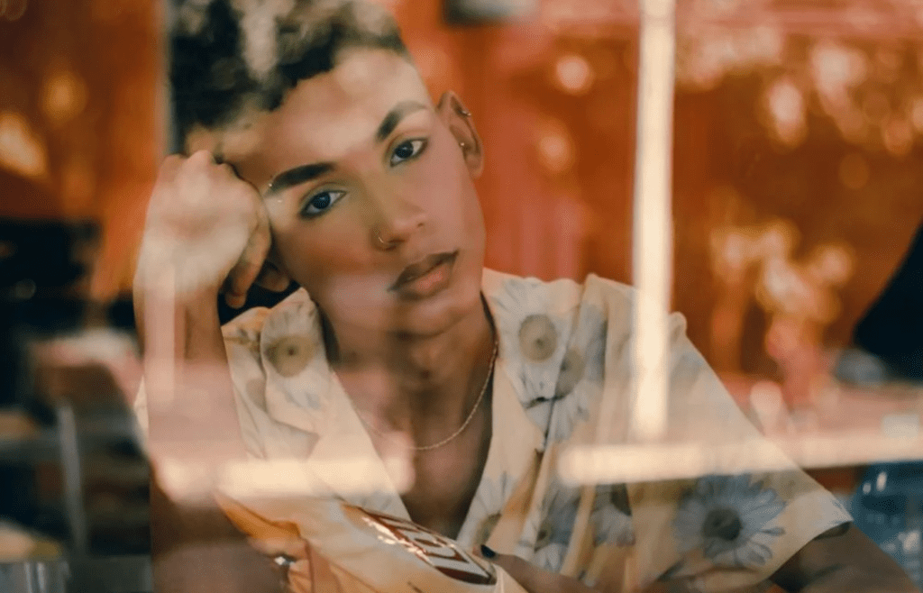 A person sitting quietly, looking tense