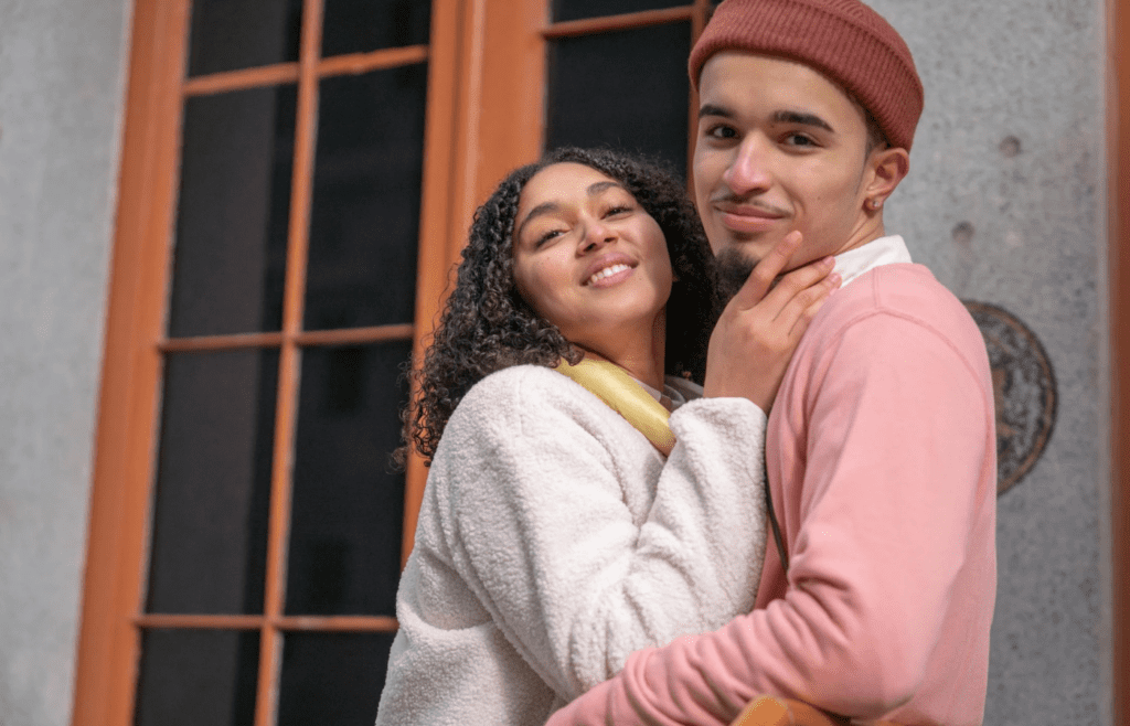 A couple embracing at the door