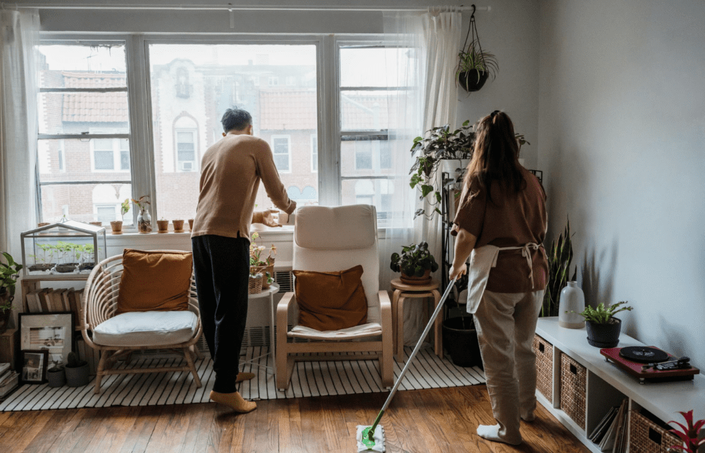 A couple cleaning the house together