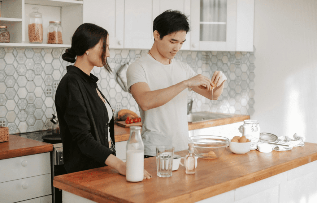 A couple cooking Sunday breakfast together