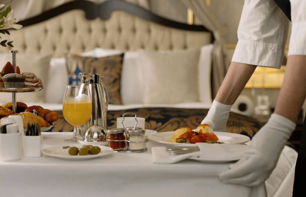A hotel breakfast buffet with fresh pastries and fruit