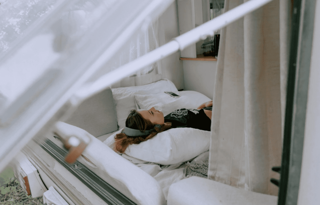 A traveler dozing comfortably with a supportive travel pillow