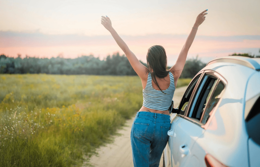 A traveler picking up a sporty rental car