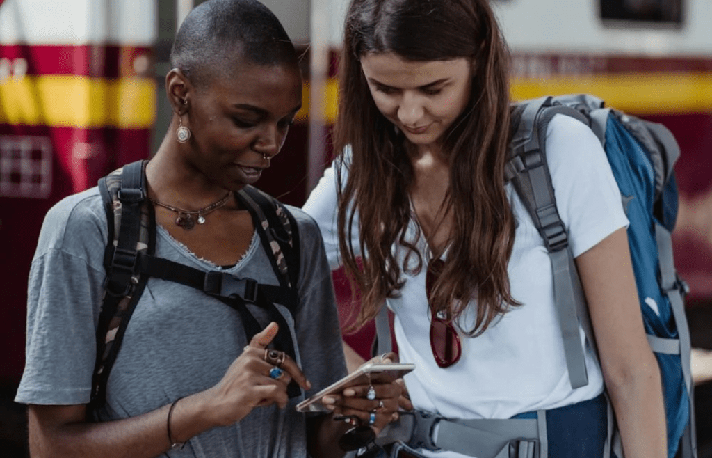 A traveler checking travel rewards on a smartphone