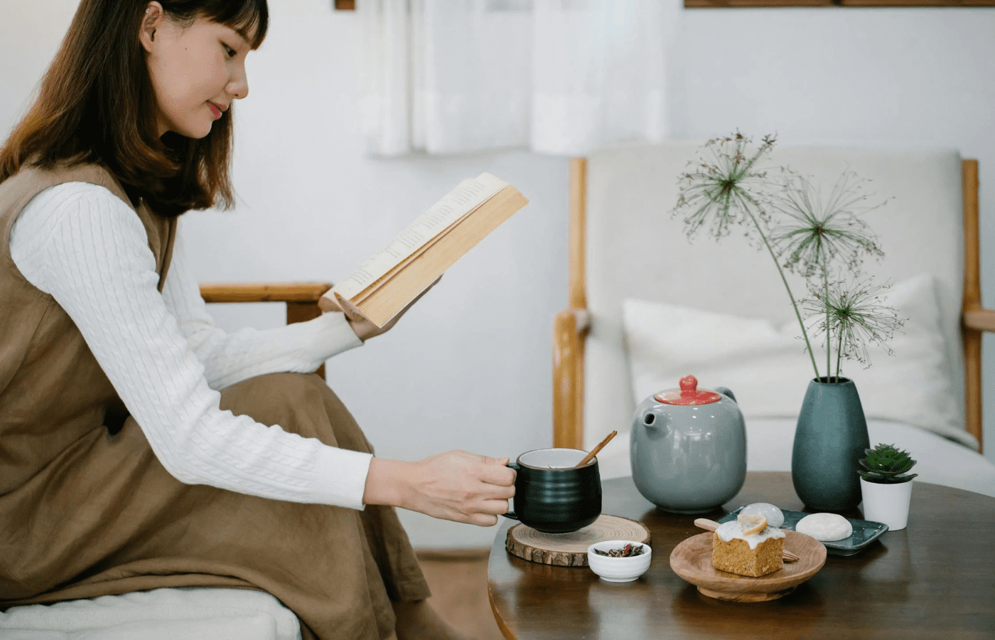 A person treating themselves to a quiet reward—like reading or a snack