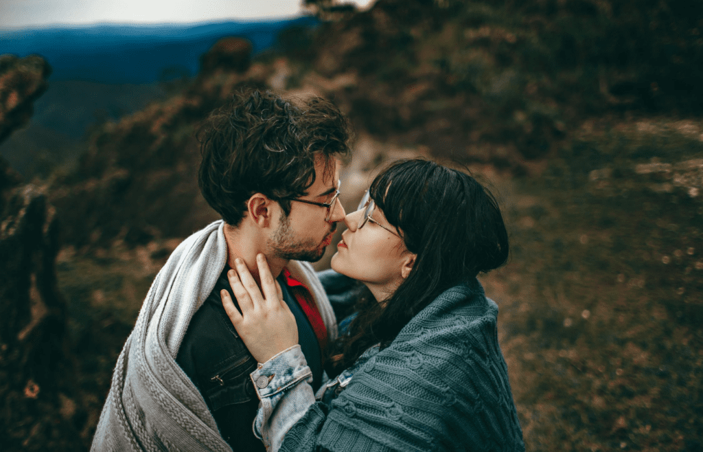 Two people hugging or a person wrapped in a blanket