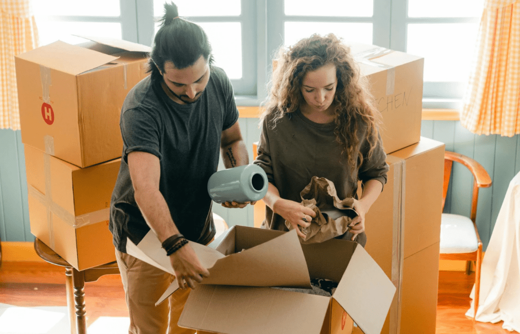 A couple unpacking together in a new home
