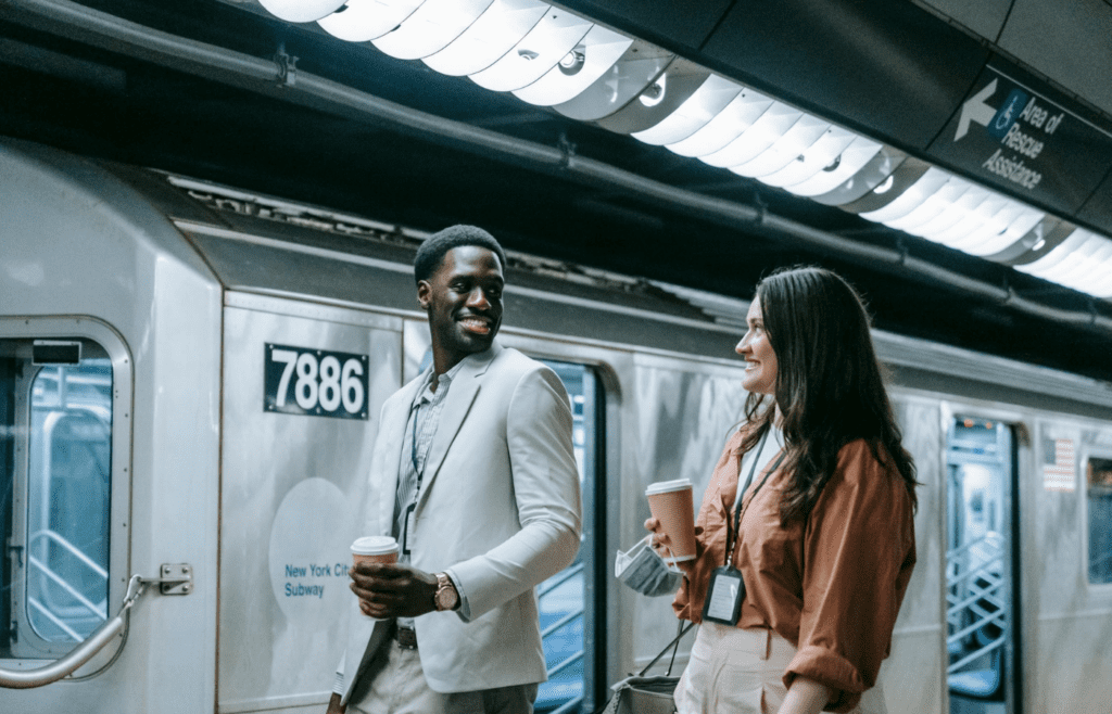 A couple smiling at each other while cooking or walking