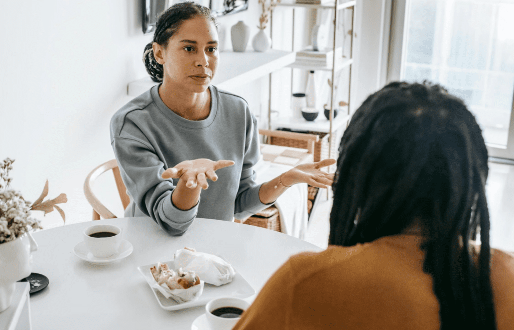 A couple deep in discussion over coffee