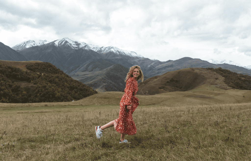 A person smiling while alone on a walk