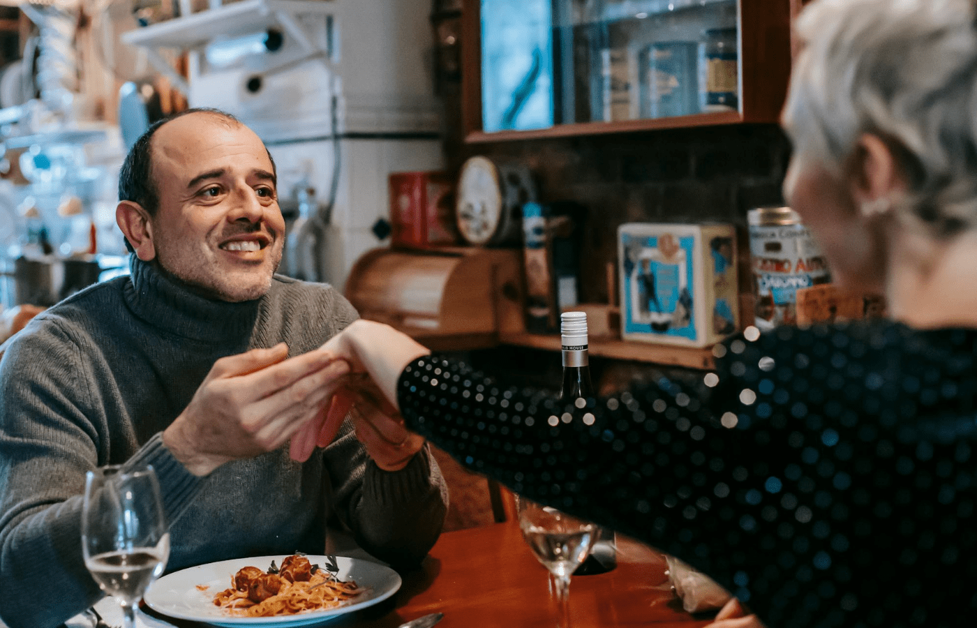 A couple enjoying dinner at a cozy restaurant