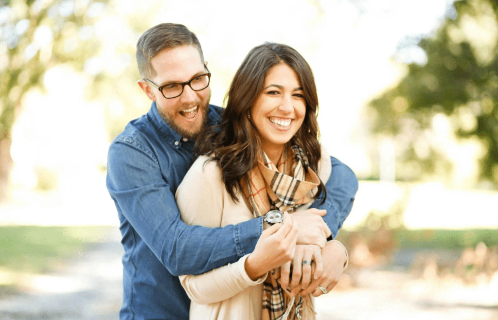 A couple laughing uncontrollably together