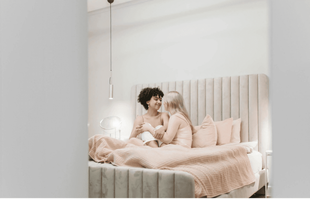 A couple holding each other in bed