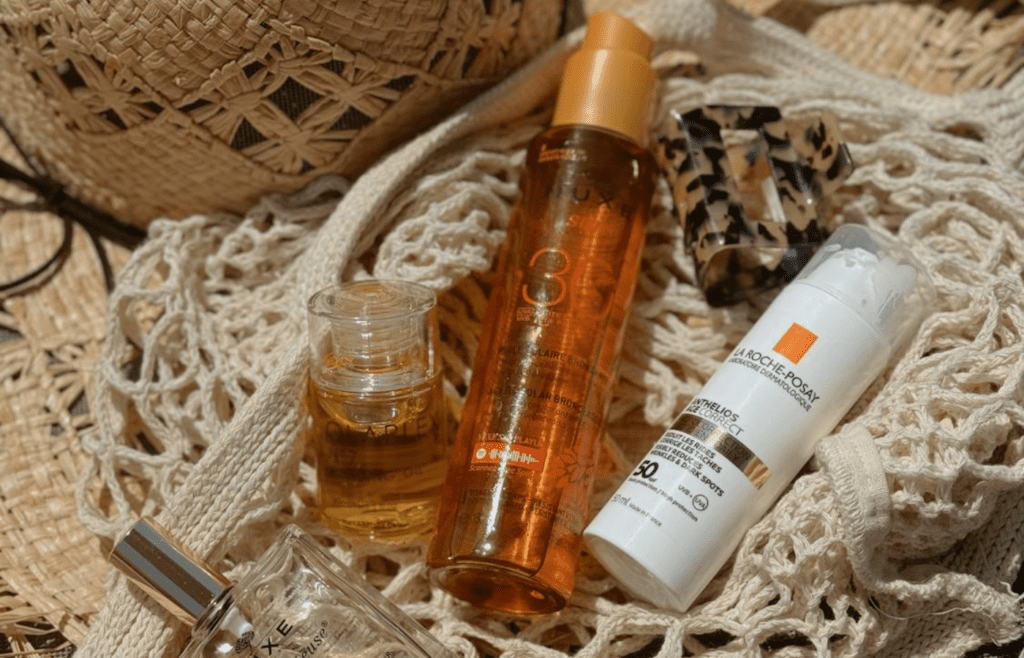 A tube of sunscreen tossed into a beach bag