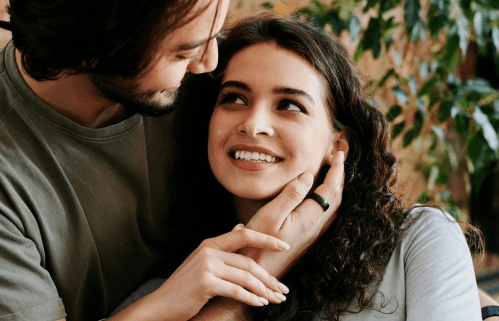 A couple smiling warmly at each other