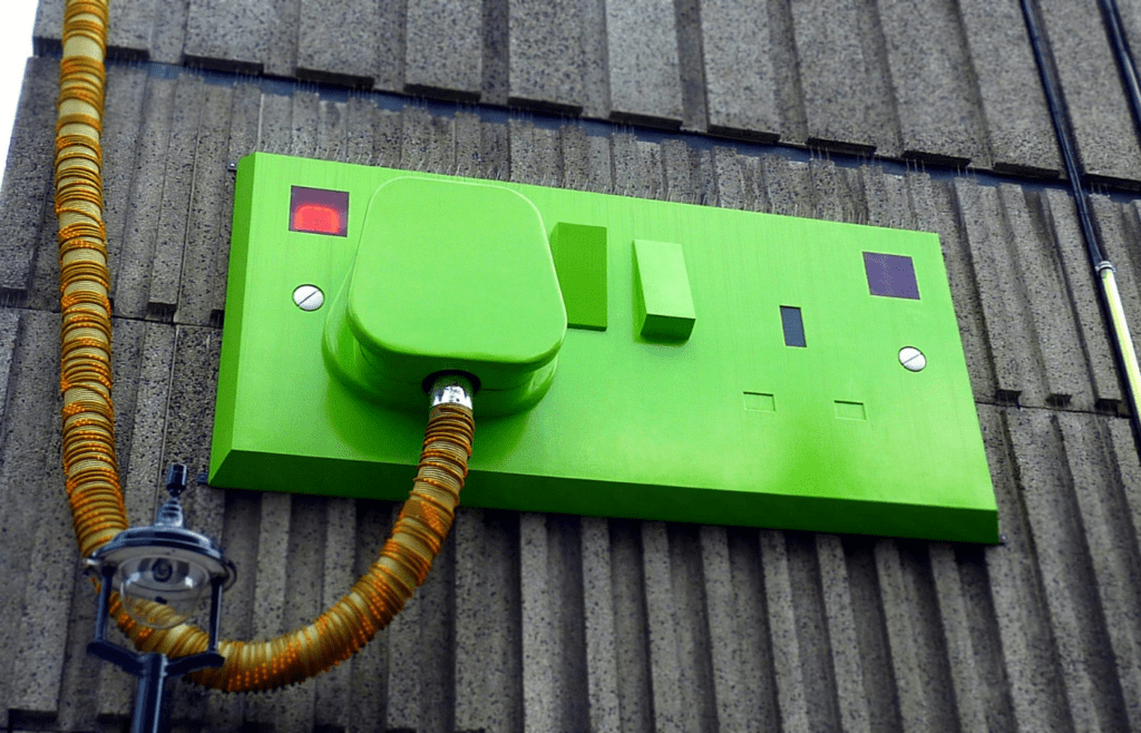 A power strip with surge protection plugged into a wall