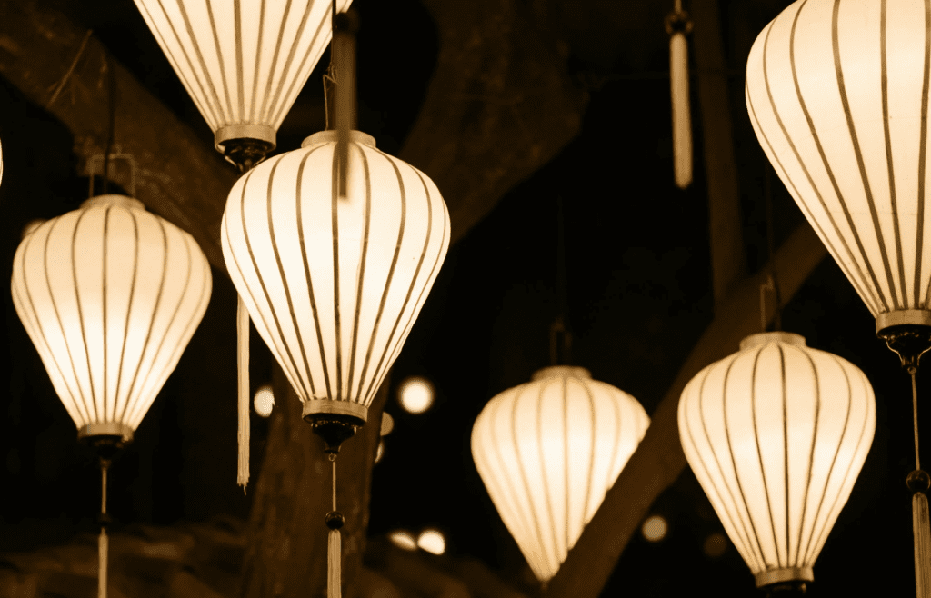 A boho-style lantern hanging inside a tent