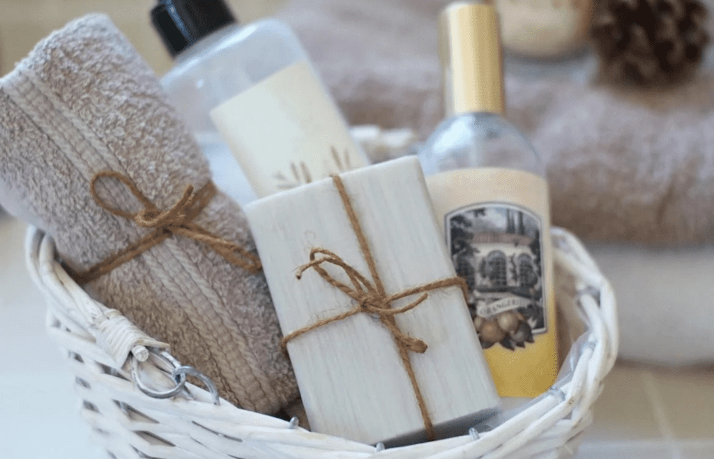 A basket of spa items like lotion, face masks, and essential oils