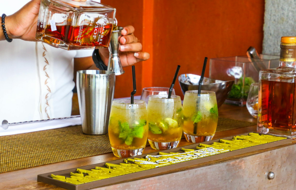A small kit with cocktail shakers, mixers, and glasses
