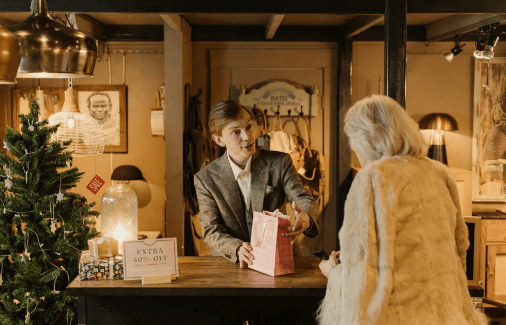 A person justifying a luxury purchase alone in a quiet store