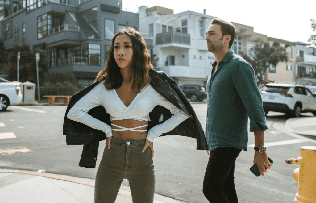A tense couple mid-discussion, one walking away